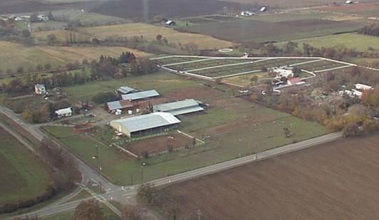 Aerial view of Russell Ranch showing barns, arena and pastures west of Davis
